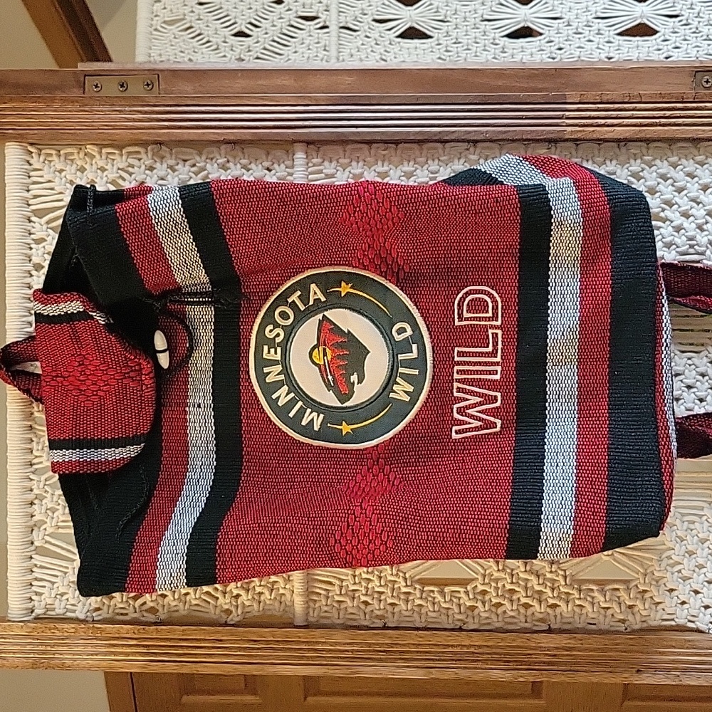 Minnesota Wild Backpack. Woven Fabric. Length 16" Width 14". Drawstring For Top.